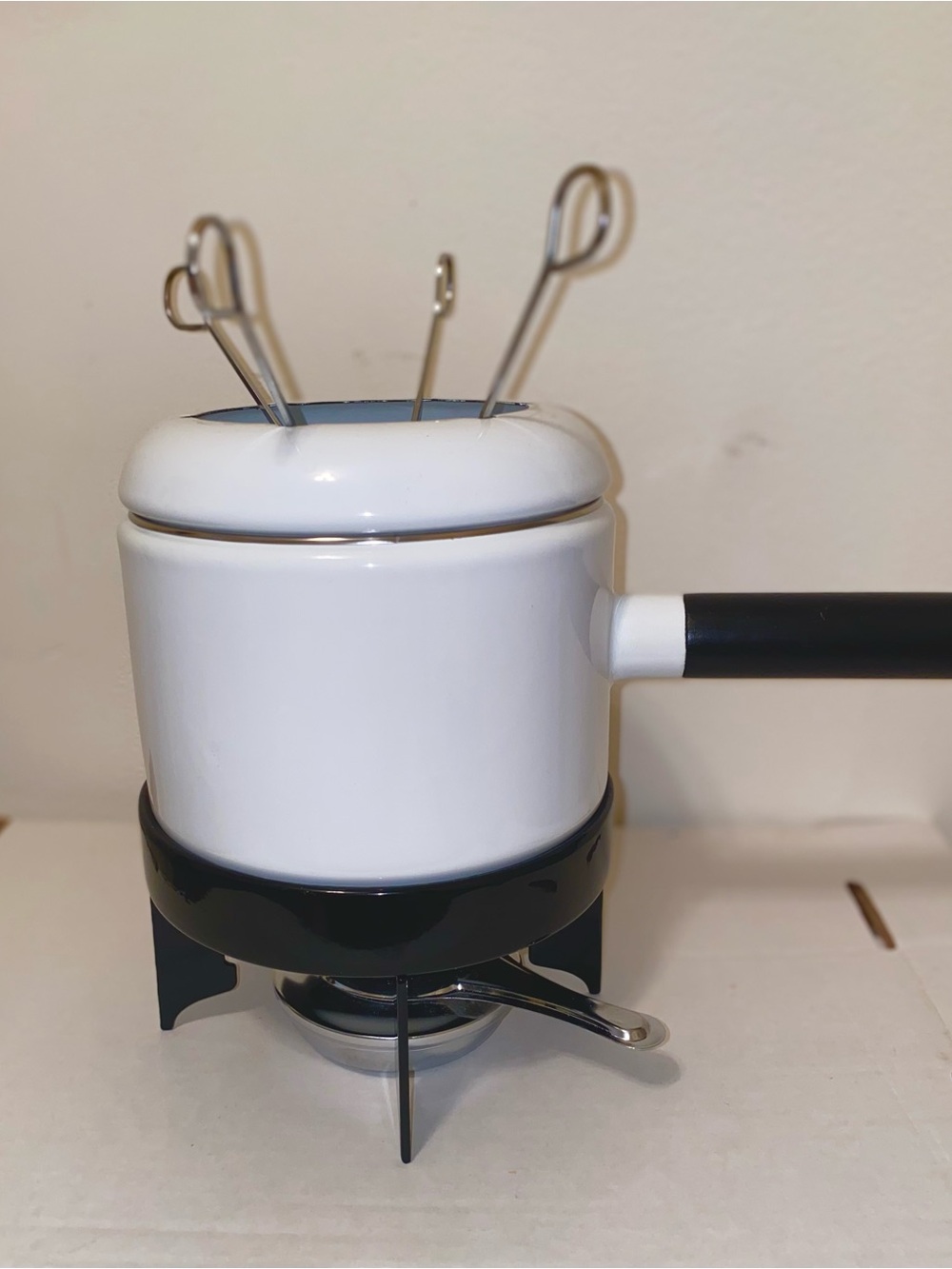 White Metal Fondue Pot/Black Handle - 4 Silver Forks. Black Stand. Fuel Holder.